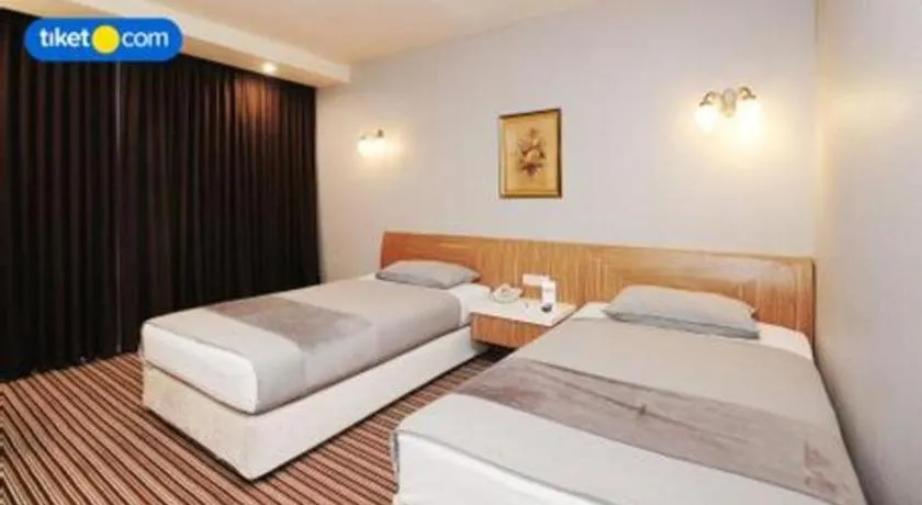 Bed in Kenari Tower Hotel