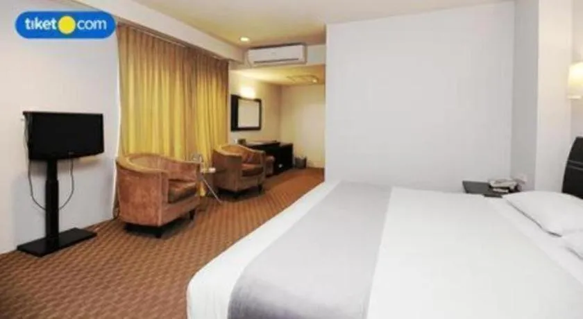 Bed in Kenari Tower Hotel