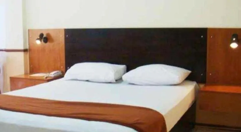 Bed in Hotel Augusta Jakarta