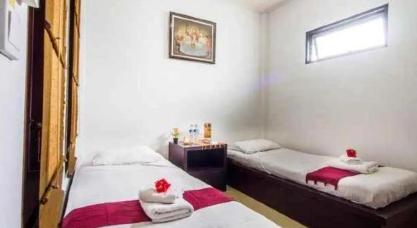 Bed in Al-Isha Dharamshala