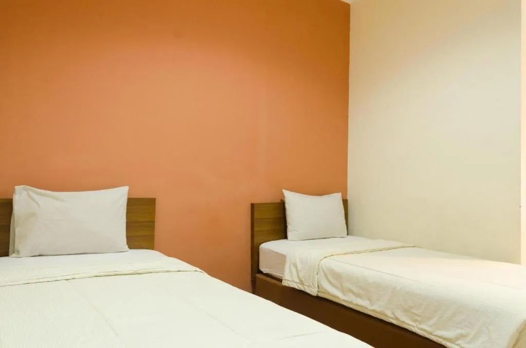 Bed in Lotus Bandung Hotel, Cafe, and Meeting Place