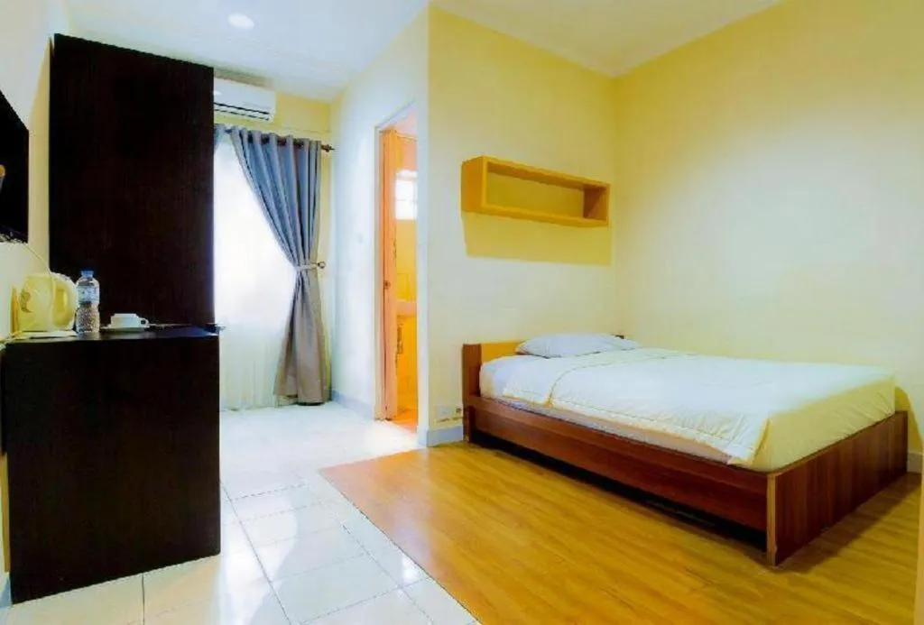 Bed in Lotus Bandung Hotel, Cafe, and Meeting Place