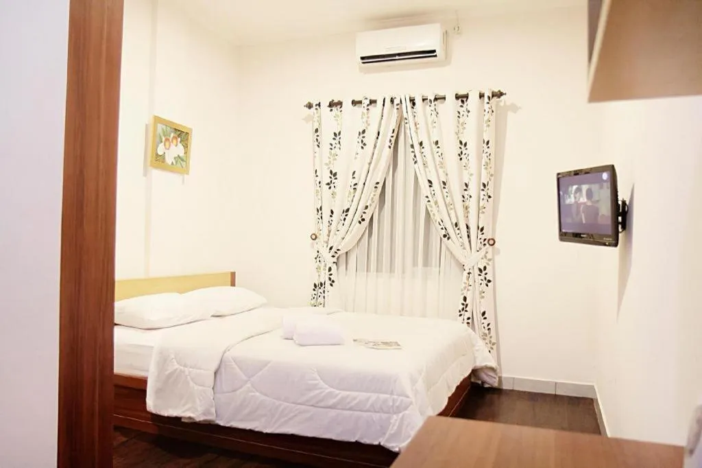 Bed in Lotus Bandung Hotel, Cafe, and Meeting Place