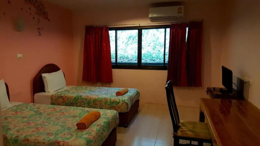 Bed in Baan Suan Sook Resort