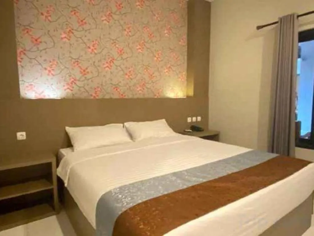 Bed in Grand Mutiara Hotel