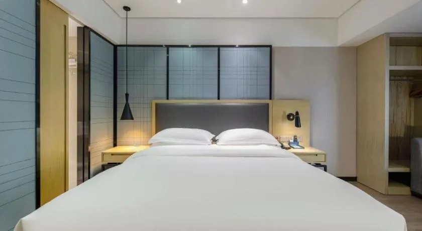 Bed in Echarm Hotel Beihai Railway Station