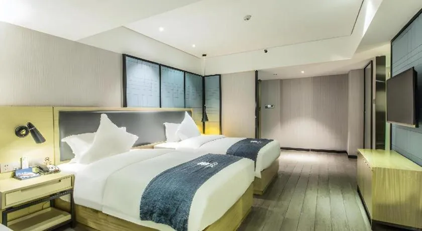 Bed in Echarm Hotel Beihai Railway Station