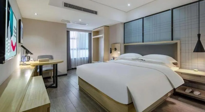 Bed in Echarm Hotel Beihai Railway Station