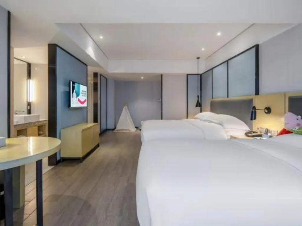 Bed in Echarm Hotel Beihai Railway Station