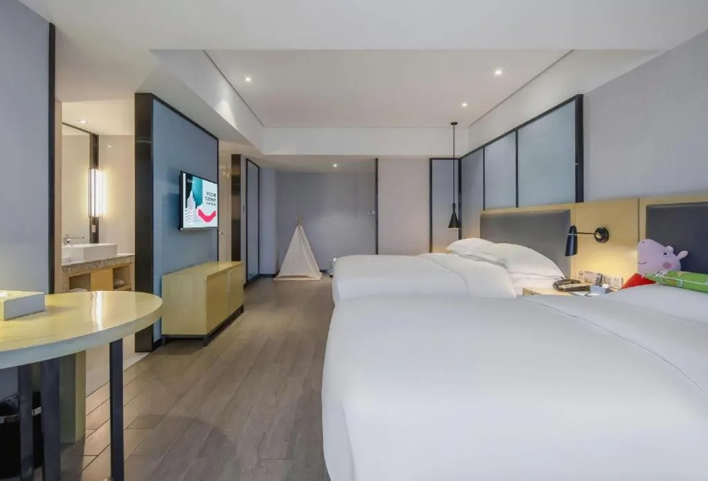 Bed in Echarm Hotel Beihai Railway Station