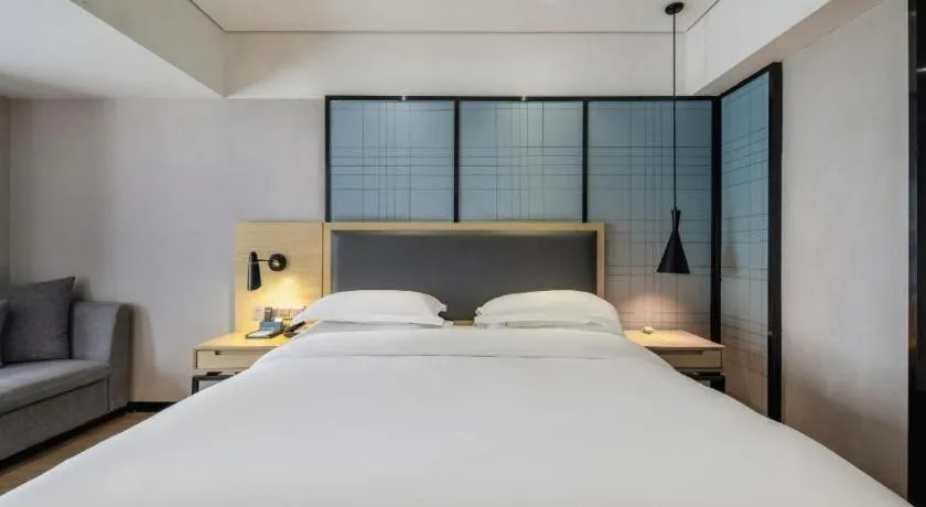 Bed in Echarm Hotel Beihai Railway Station