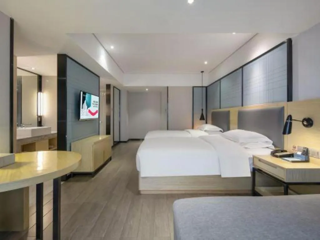 Bed in Echarm Hotel Beihai Railway Station