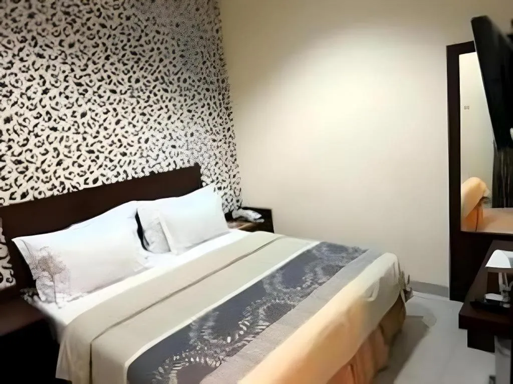 Bed in Vindhika Hotel