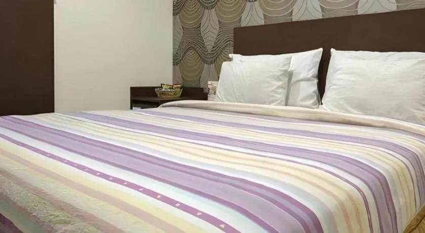 Bed in Vindhika Hotel