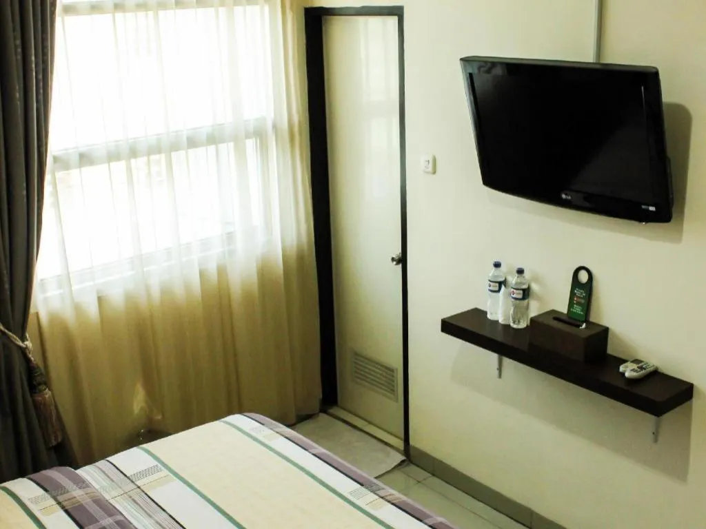 Bed in Vindhika Hotel