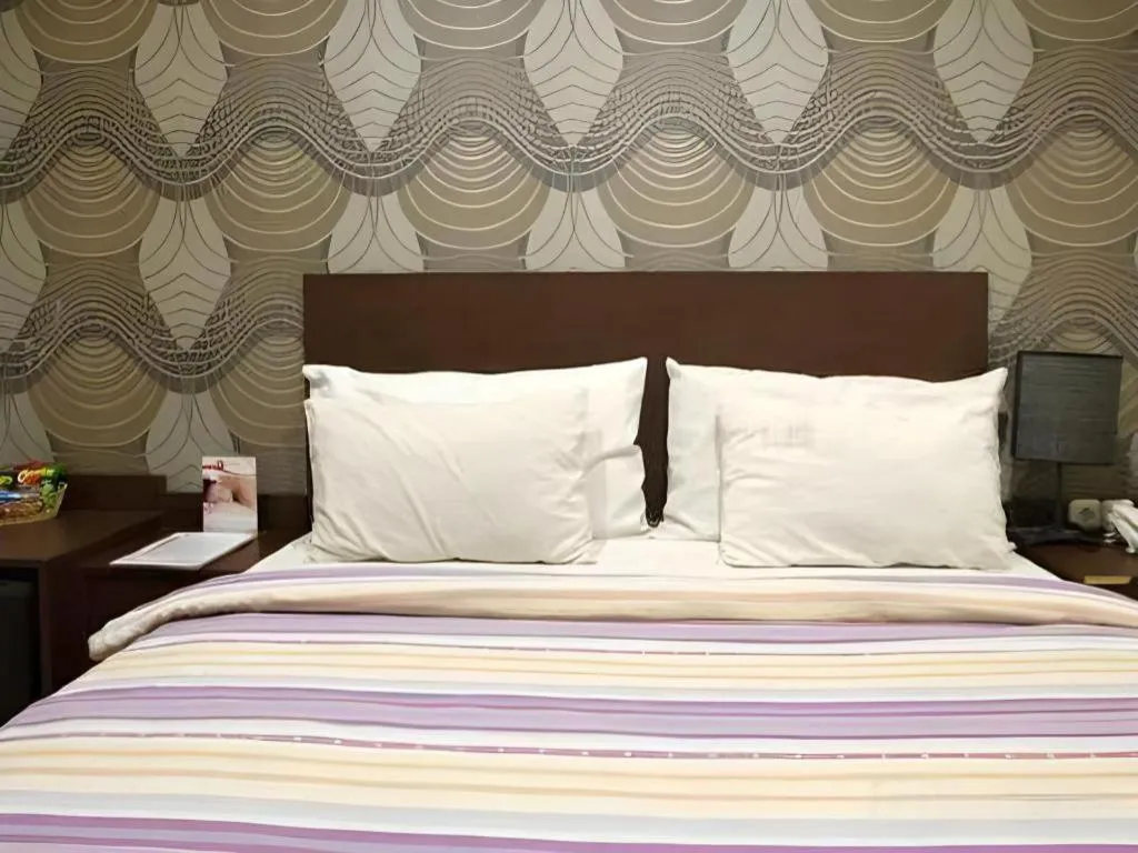 Bed in Vindhika Hotel