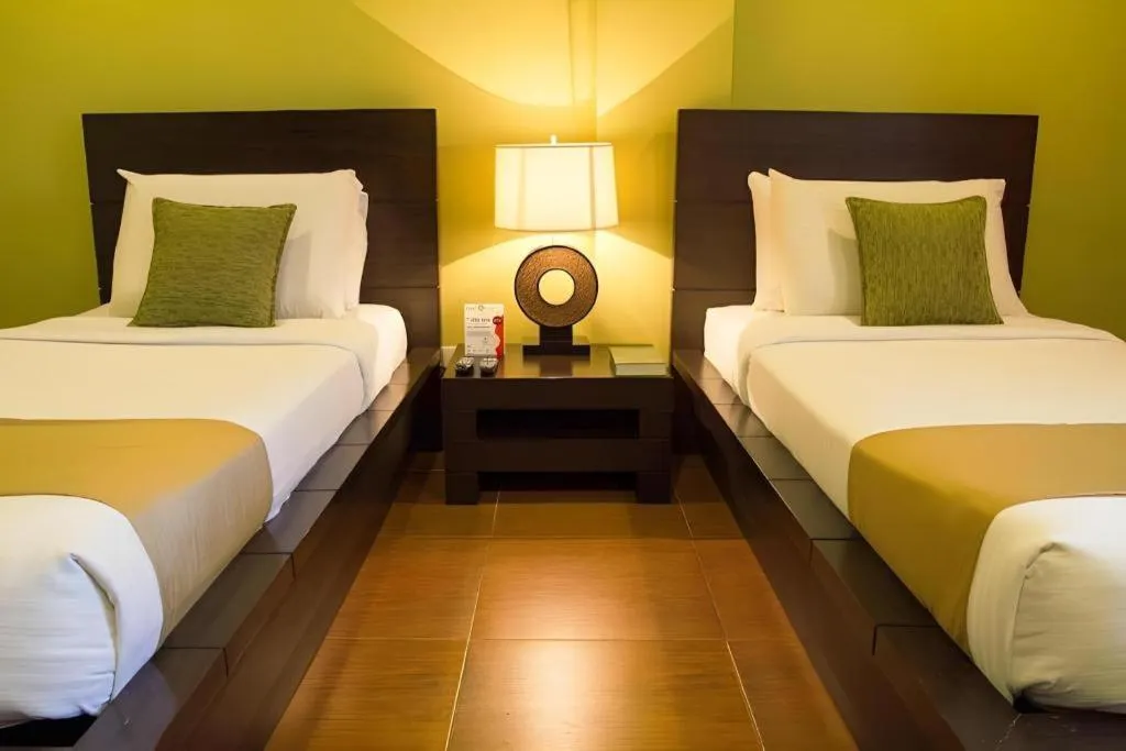 Bed in Home Crest Hotel