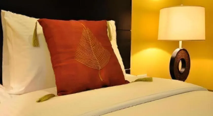 Bed in Home Crest Hotel