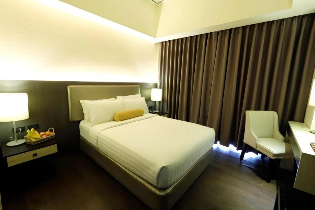 Bed in Home Crest Hotel