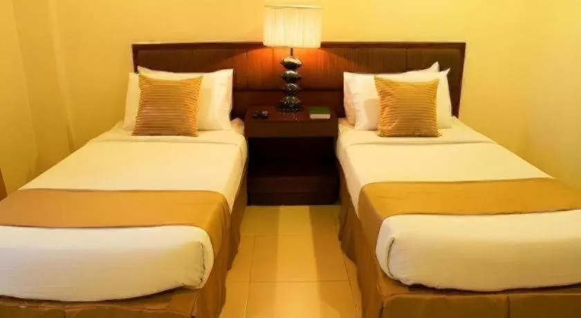 Bed in Home Crest Hotel