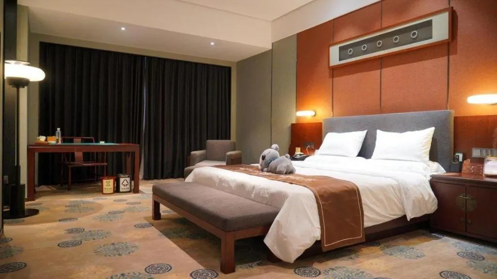 Bed in Rezen Hotel Pasonda Junyu