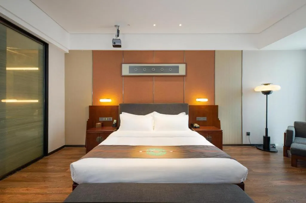 Bed in Rezen Hotel Pasonda Junyu