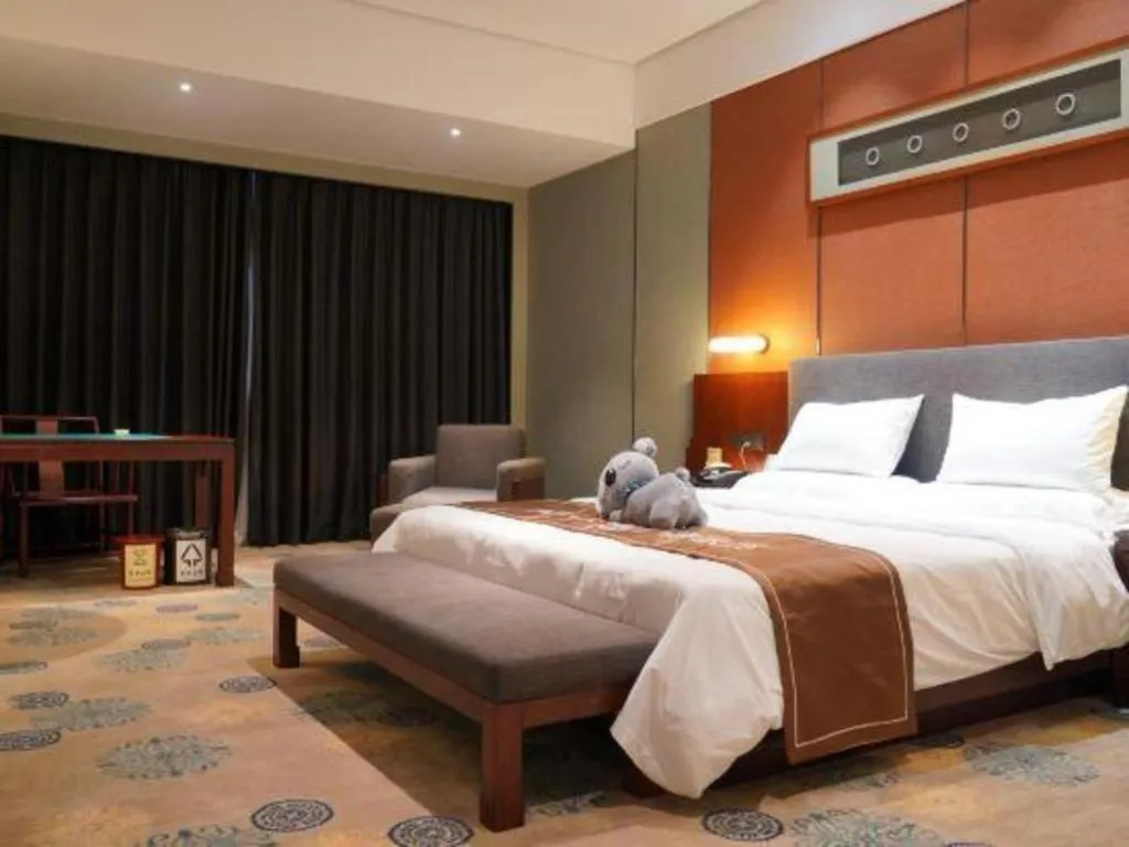 Bed in Rezen Hotel Pasonda Junyu