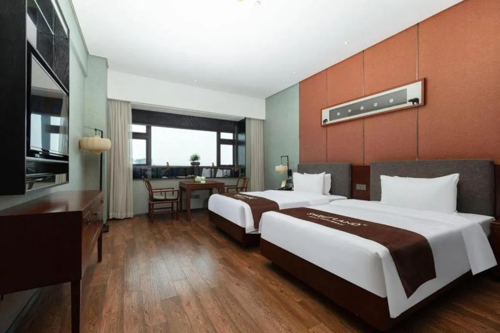 Bed in Rezen Hotel Pasonda Junyu