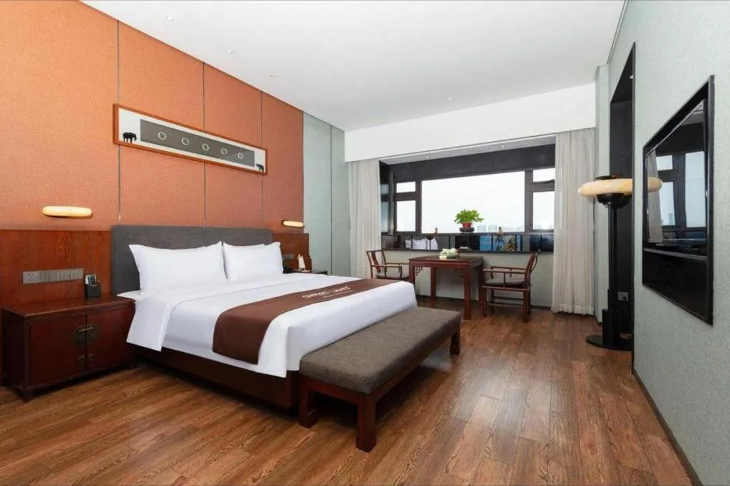 Bed in Rezen Hotel Pasonda Junyu