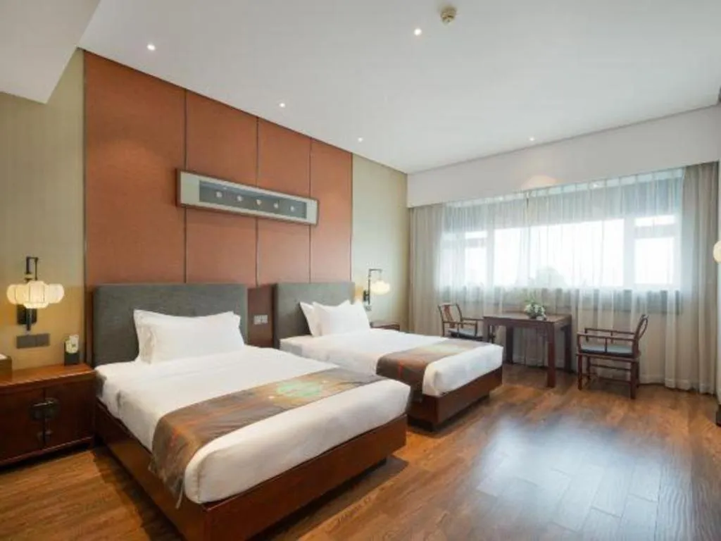 Bed in Rezen Hotel Pasonda Junyu