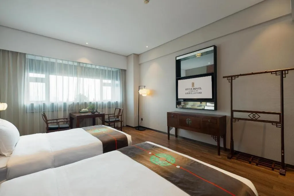 Bed in Rezen Hotel Pasonda Junyu