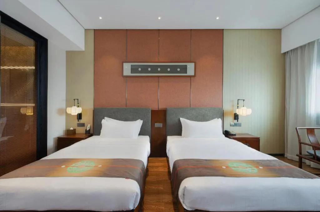 Bed in Rezen Hotel Pasonda Junyu