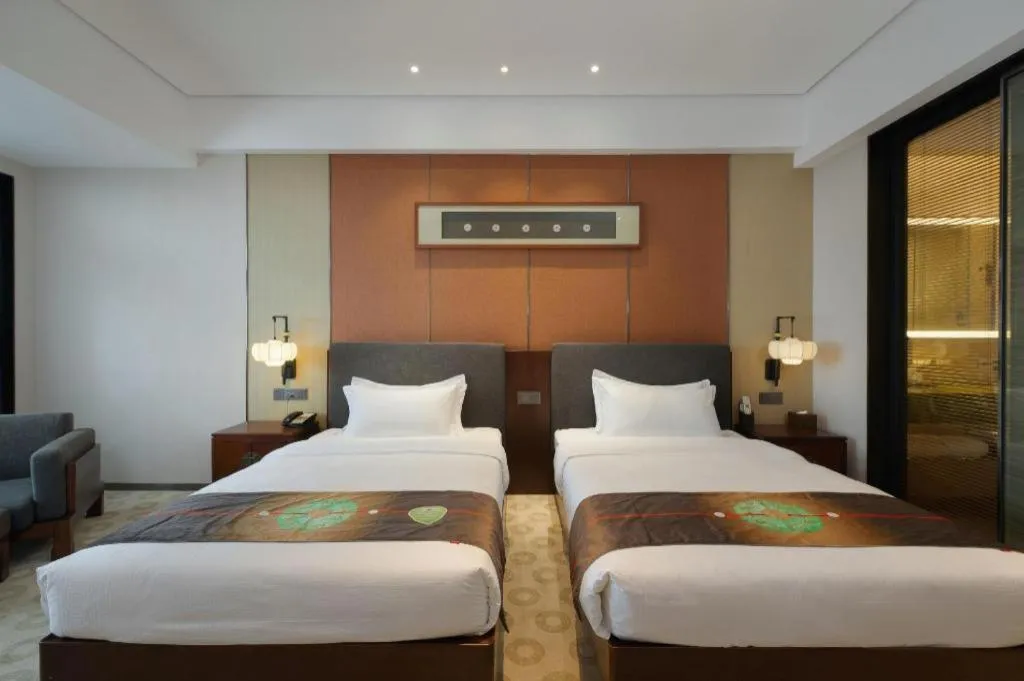 Bed in Rezen Hotel Pasonda Junyu