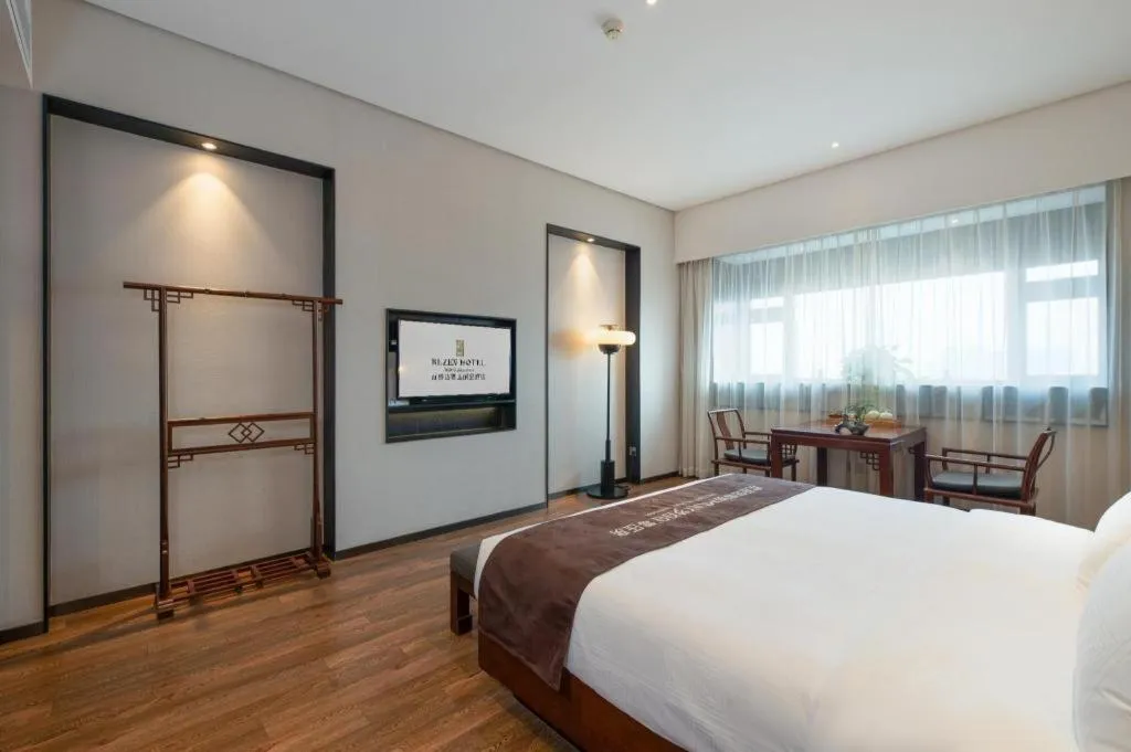 Bed in Rezen Hotel Pasonda Junyu