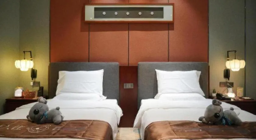 Bed in Rezen Hotel Pasonda Junyu