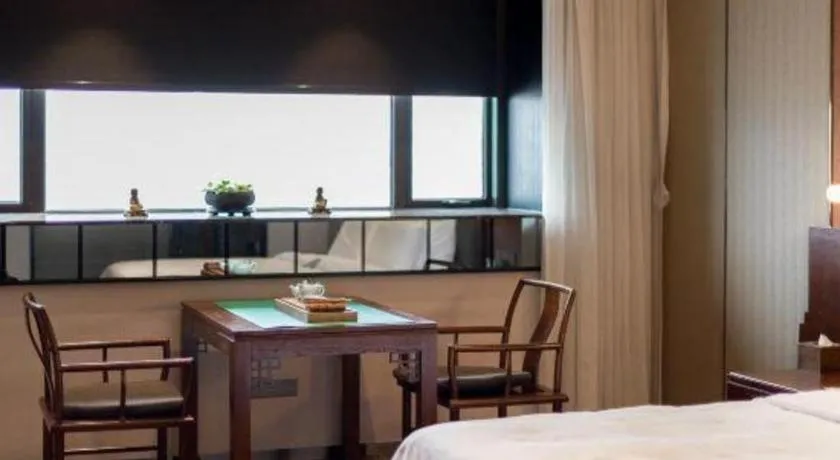 Bed in Rezen Hotel Pasonda Junyu