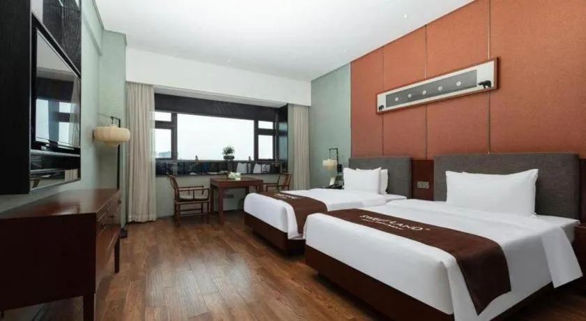 Bed in Rezen Hotel Pasonda Junyu