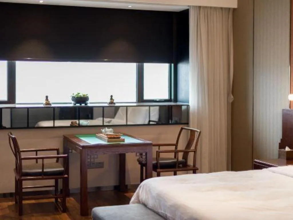 Bed in Rezen Hotel Pasonda Junyu