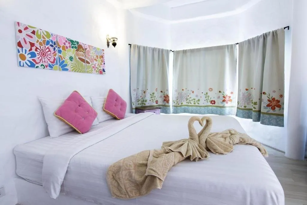 Bed in Rak Na Suan Pueng Resort