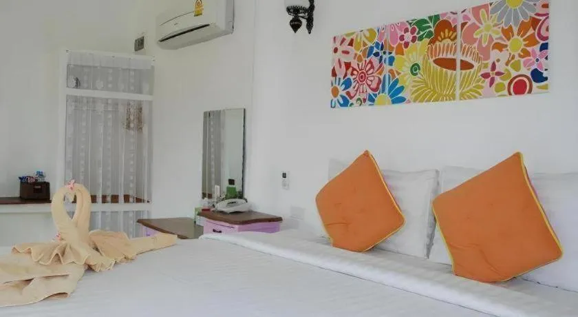 Bed in Rak Na Suan Pueng Resort