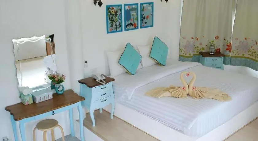 Bed in Rak Na Suan Pueng Resort