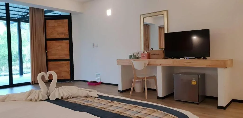 Bed in Rak Na Suan Pueng Resort