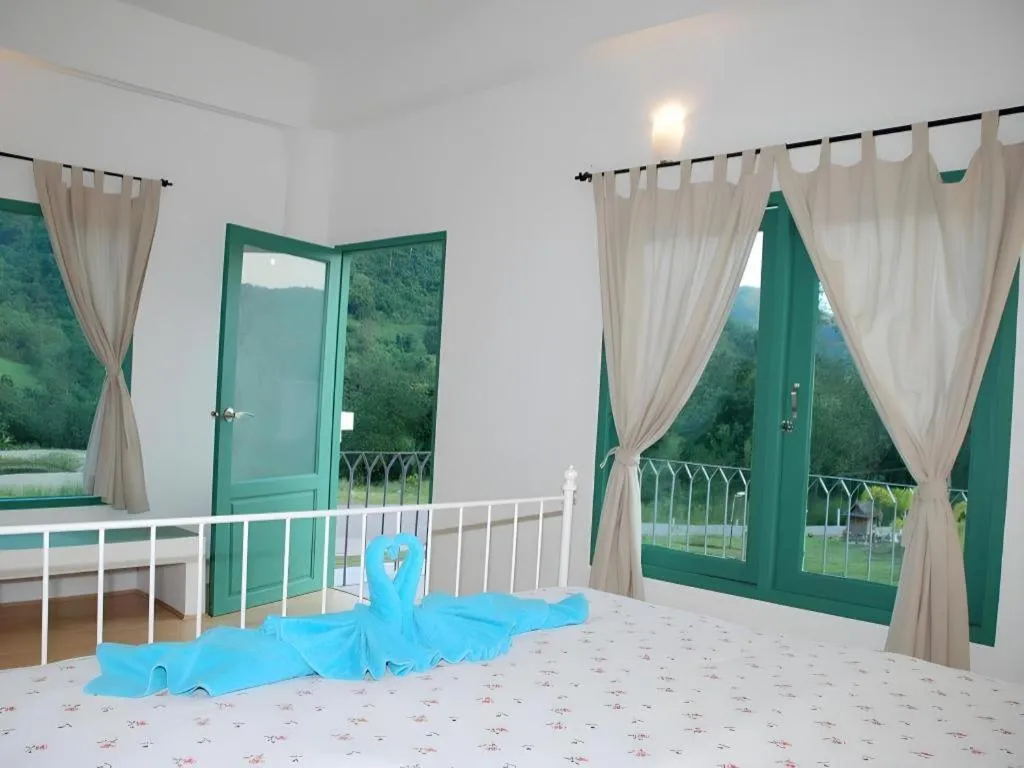 Bed in Rak Na Suan Pueng Resort