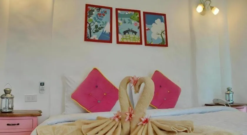 Bed in Rak Na Suan Pueng Resort