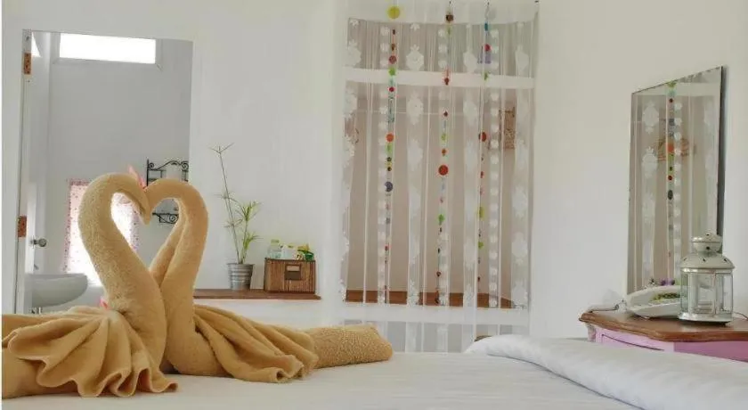 Bed in Rak Na Suan Pueng Resort