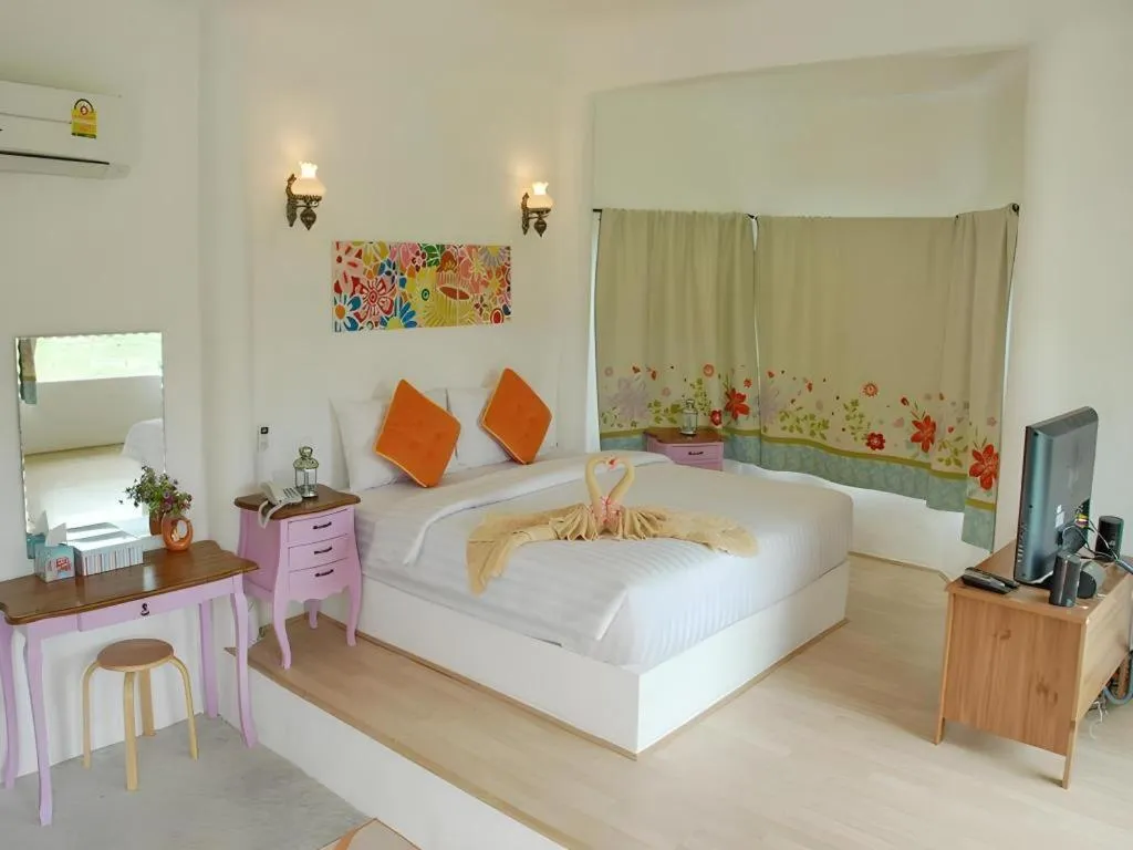 Bed in Rak Na Suan Pueng Resort