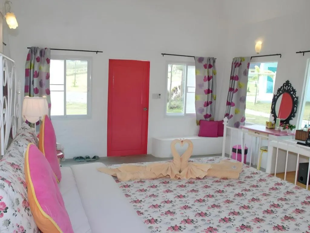 Bed in Rak Na Suan Pueng Resort