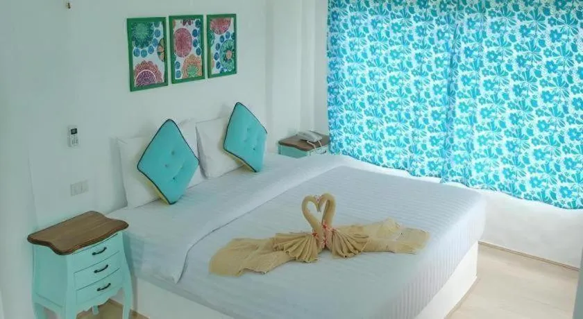Bed in Rak Na Suan Pueng Resort