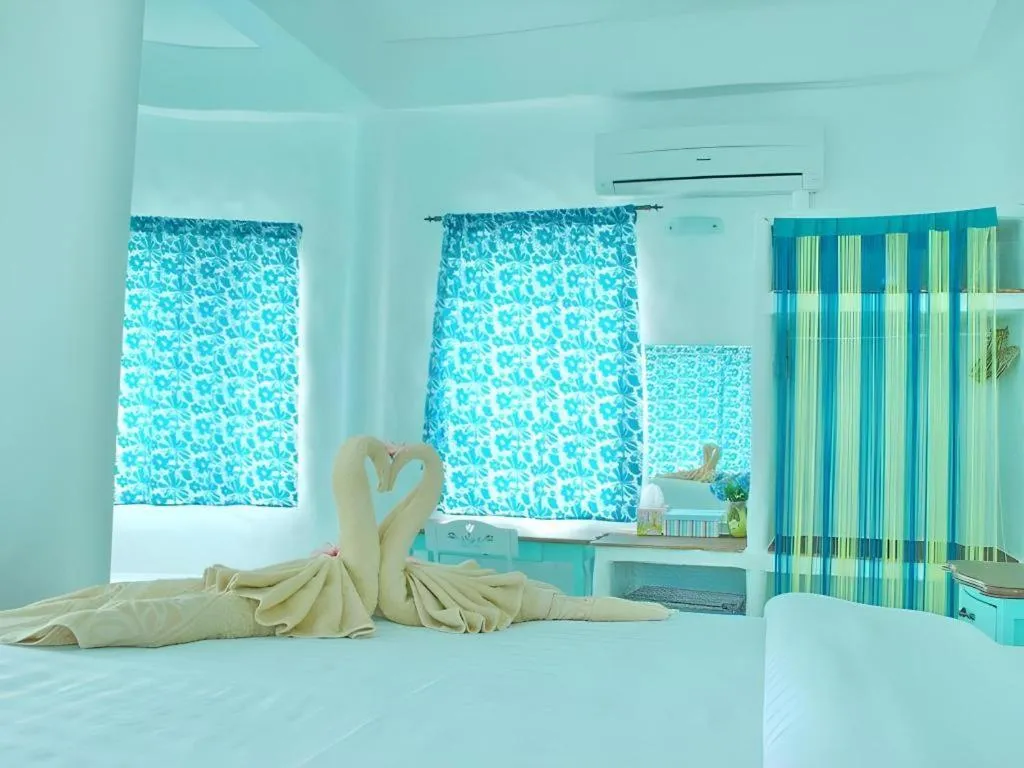 Bed in Rak Na Suan Pueng Resort