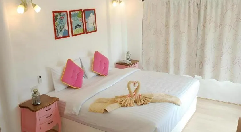 Bed in Rak Na Suan Pueng Resort